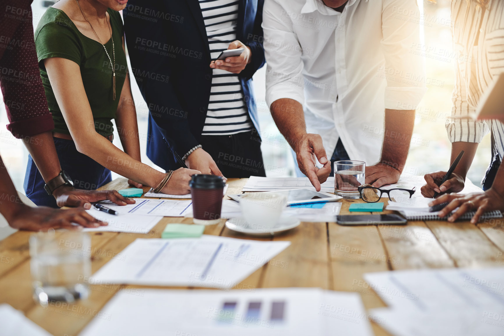 Buy stock photo Business people, hands and pointing with documents in meeting, discussion or collaboration on growth at office. Group of employees in conversation or discussing paperwork for profit or brainstorming