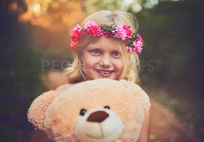 Buy stock photo Excited, flower crown and portrait of kid with teddy bear in nature for fantasy, imagination or play time in forest. Happy, sweet and cute girl child from Germany with plush toy outdoor in woods.