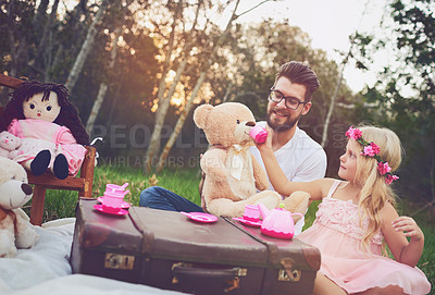 Buy stock photo Dad, tea party and girl kid in garden for nature picnic with toys, teddy bear drink and suitcase for table. Daughter, father and memory together for playing or fun, bonding and love in outdoor.