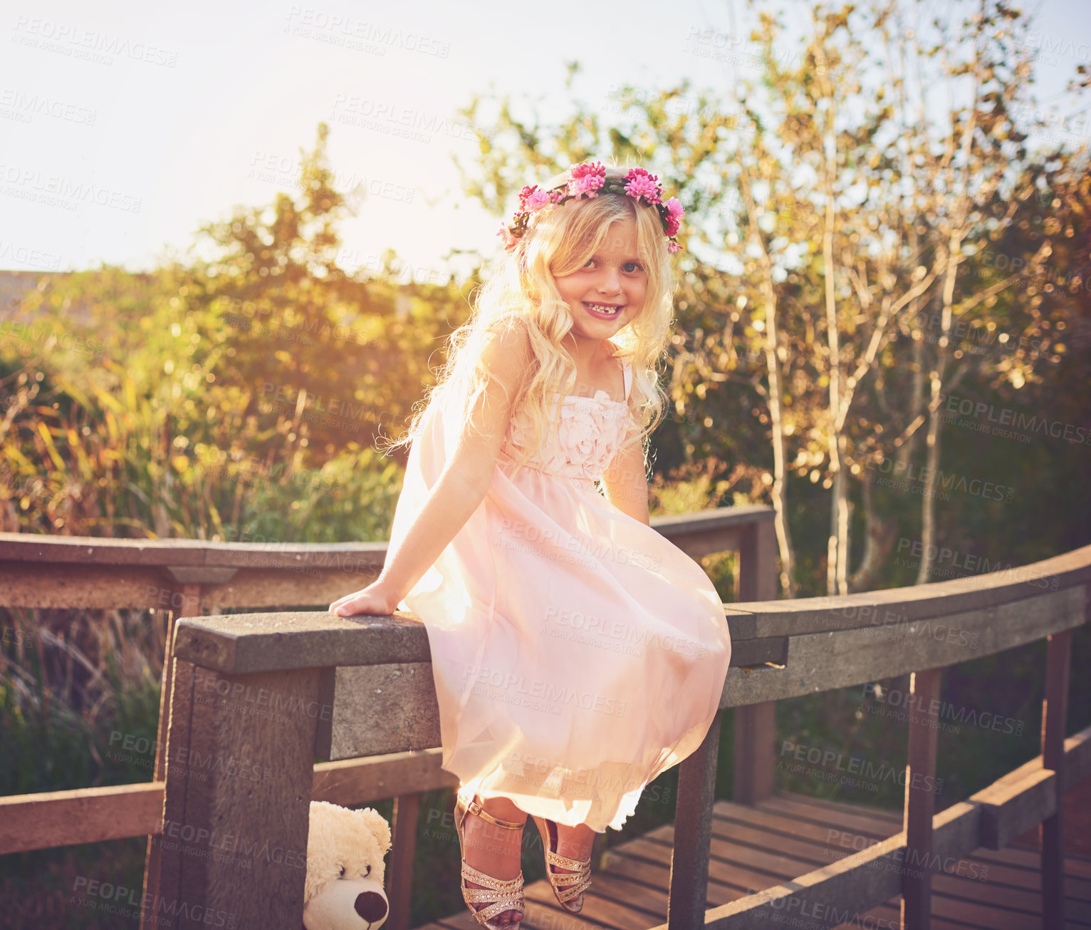 Buy stock photo Girl, smile and portrait for fun, playful expression and backyard games with flower crown. Child, kid and youth with fairy dress up, nature or garden with spring costume for birthday celebration