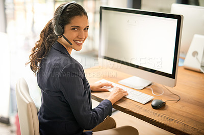 Buy stock photo High angle portrait of an attractive young woman working in a call center