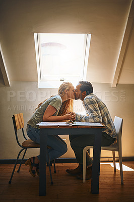 Buy stock photo Holding hands, love kiss and couple at restaurant, having fun or bonding at table. Valentines day, romance diversity or affection, kissing or care of man and woman enjoying romantic date time at cafe