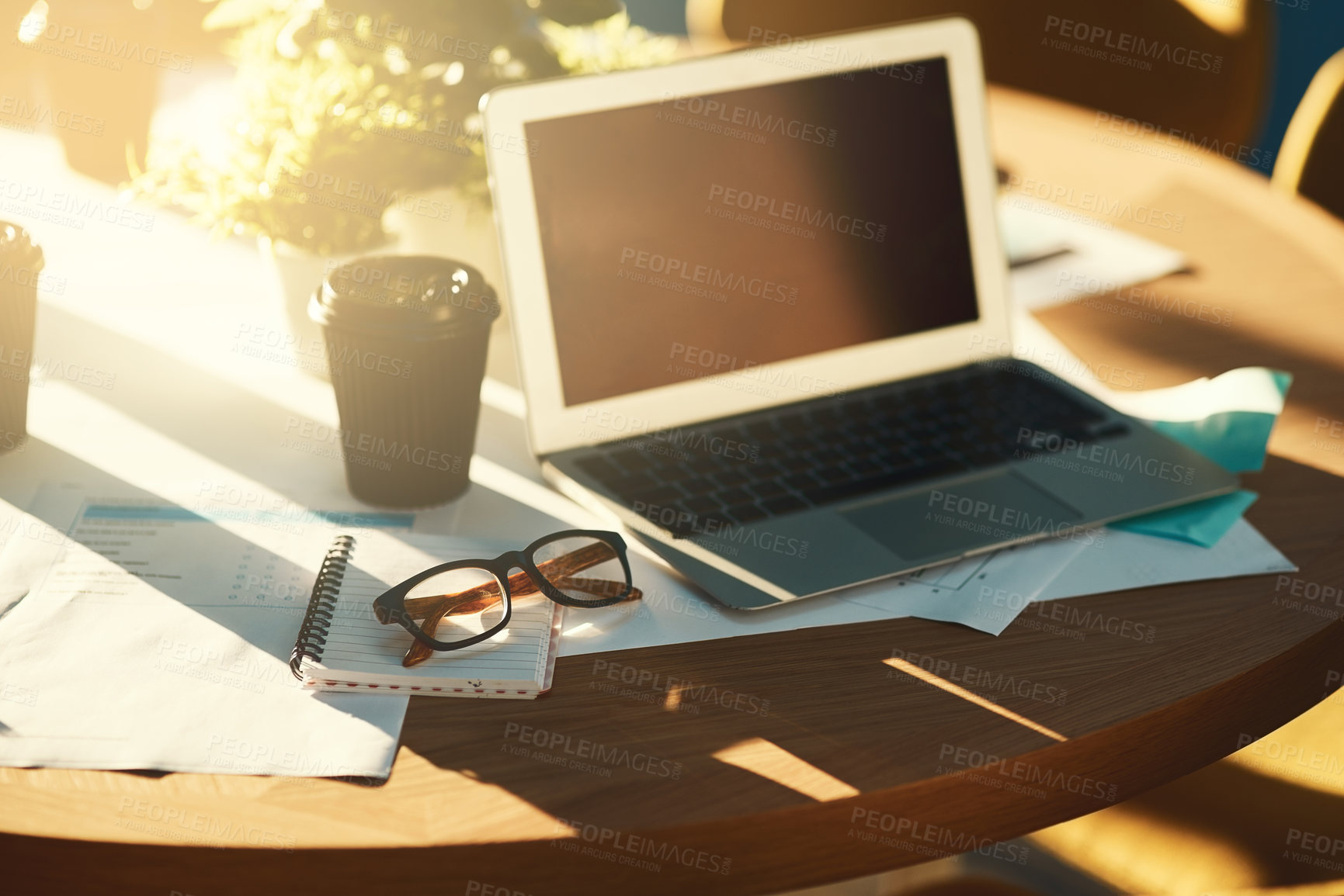Buy stock photo Laptop, screen and desk with documents in office with coffee, glasses and financial info in morning. Computer, blank and mock up space with paperwork, charts and notebook for project review in room