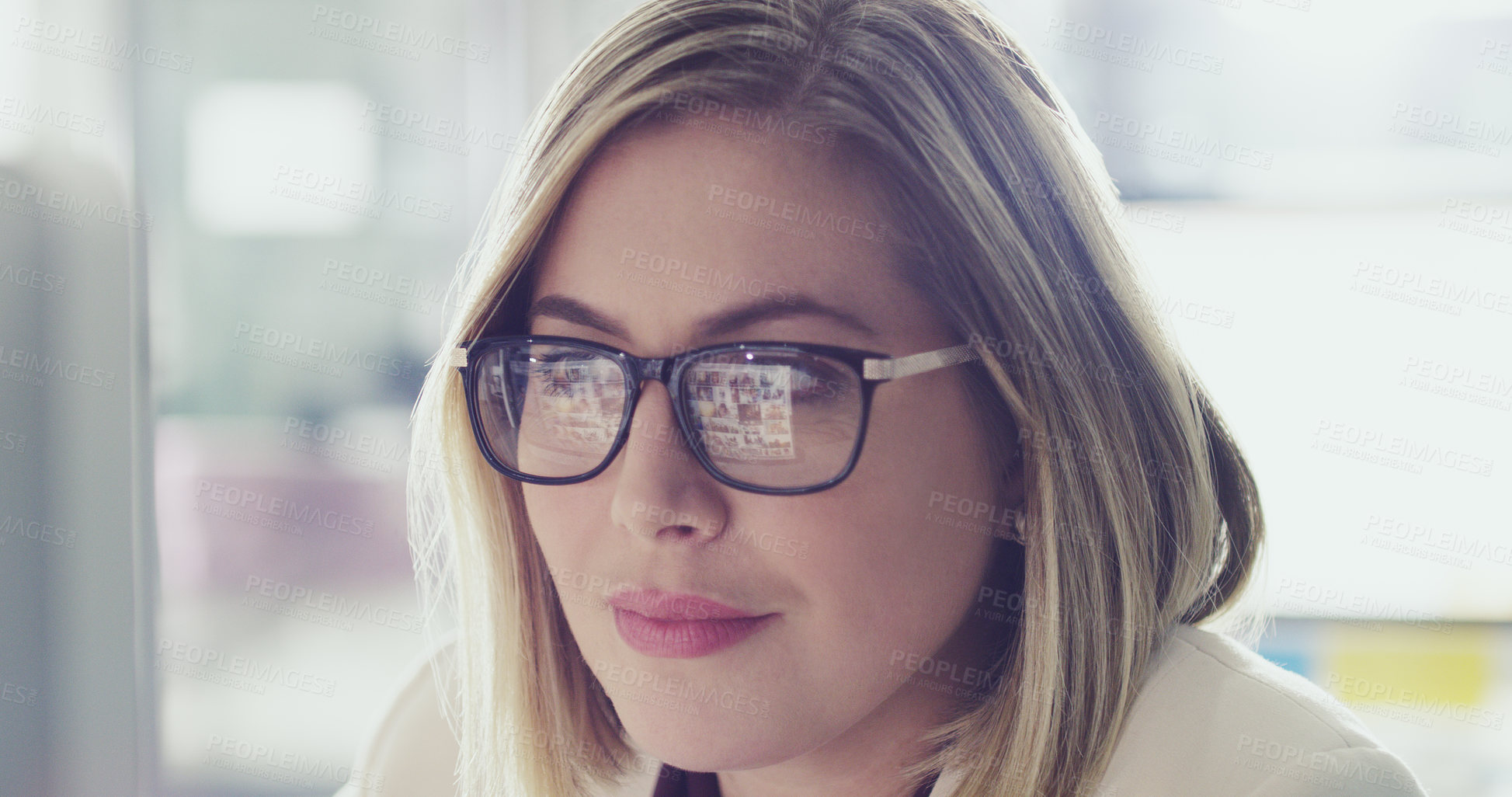 Buy stock photo Cropped shot of an attractive businesswoman working on her computer in the office