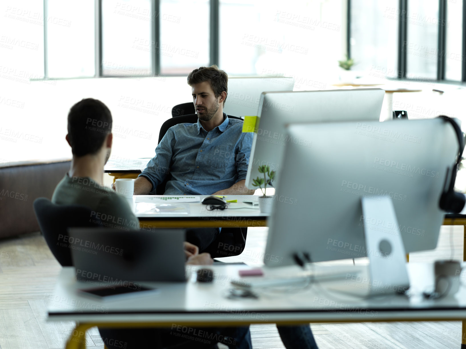 Buy stock photo Businessman, startup partnership and friends talk at desk with discussion, advice and conversation at workplace. Entrepreneur group, teamwork and chat in office for idea, planning and company goals