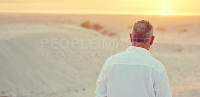 Buy stock photo Rearview shot of mature man walking on the beach at sunset