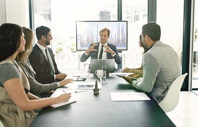 Buy stock photo Shot of corporate businesspeople meeting in the boardroom