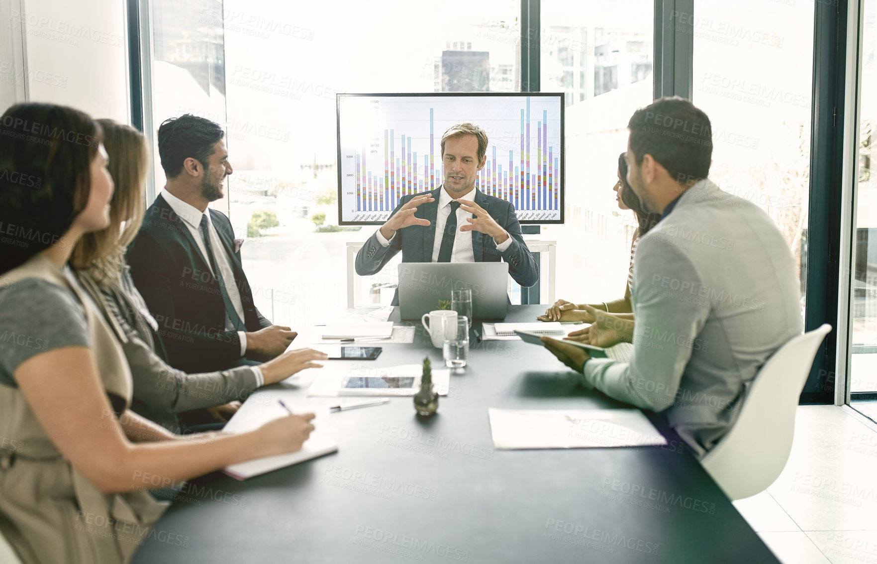 Buy stock photo Shot of corporate businesspeople meeting in the boardroom