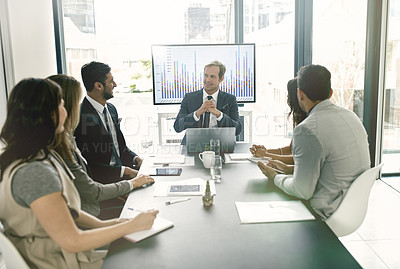 Buy stock photo Shot of corporate businesspeople meeting in the boardroom