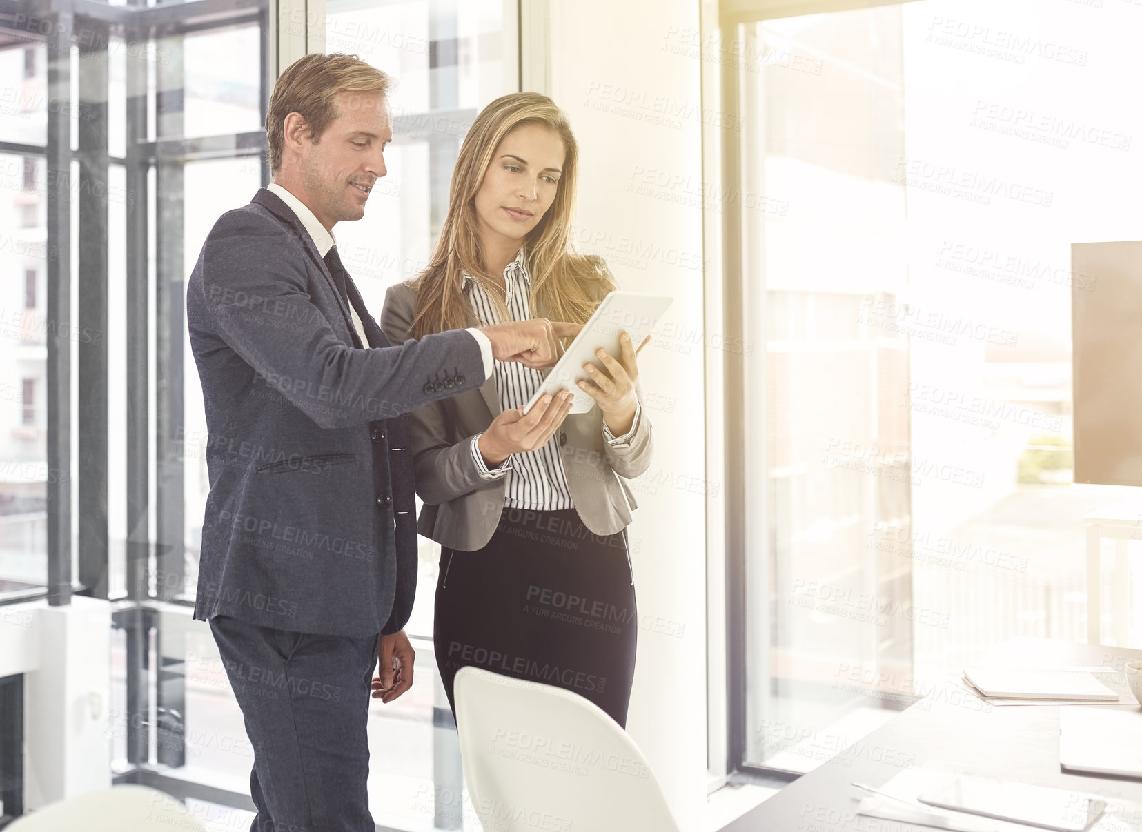 Buy stock photo Shot of a two executives working together in an office