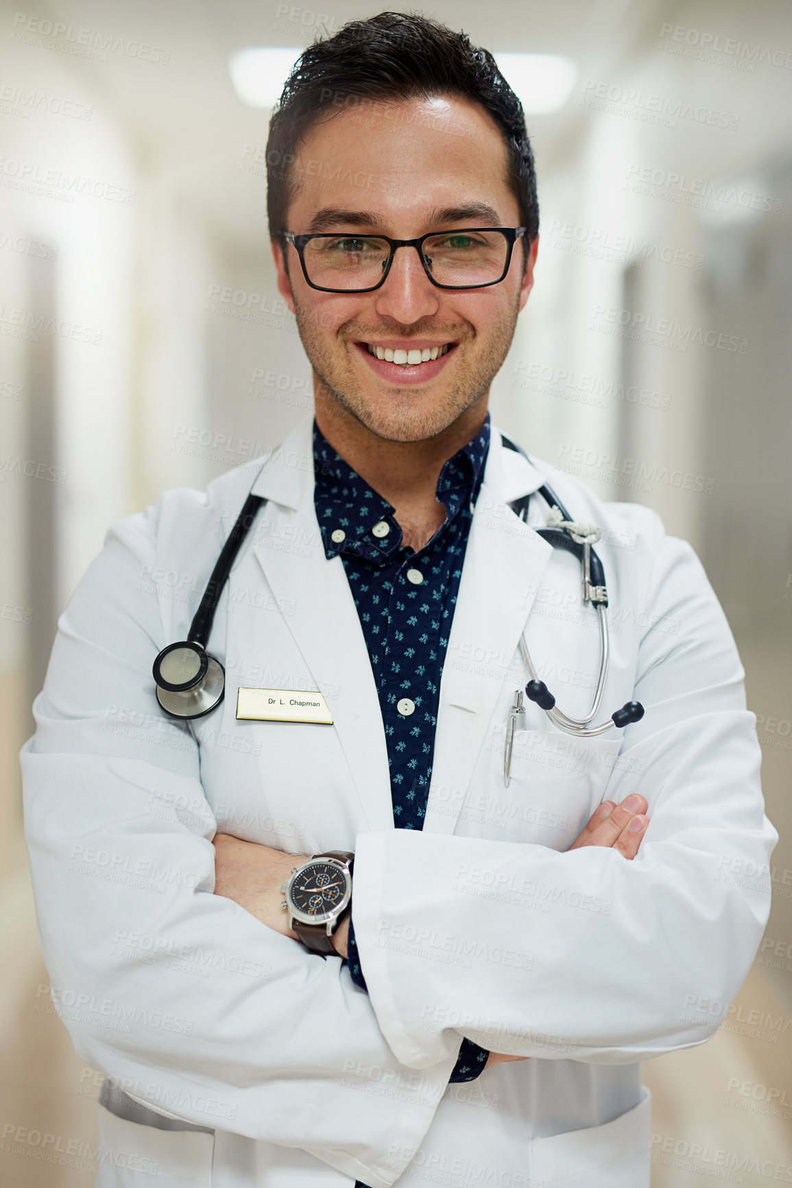 Buy stock photo Portrait of a male doctor standing in a hospital
