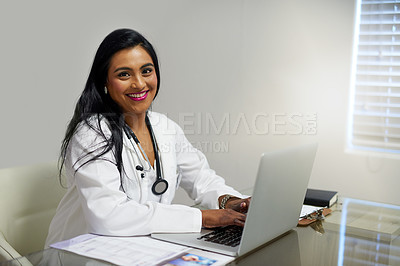 Buy stock photo Portrait of a female doctor working on a laptop in her office