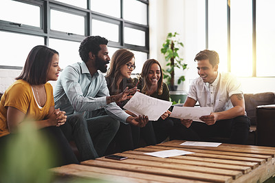 Buy stock photo Cropped shot of a group of young designers having a meeting in a modern office