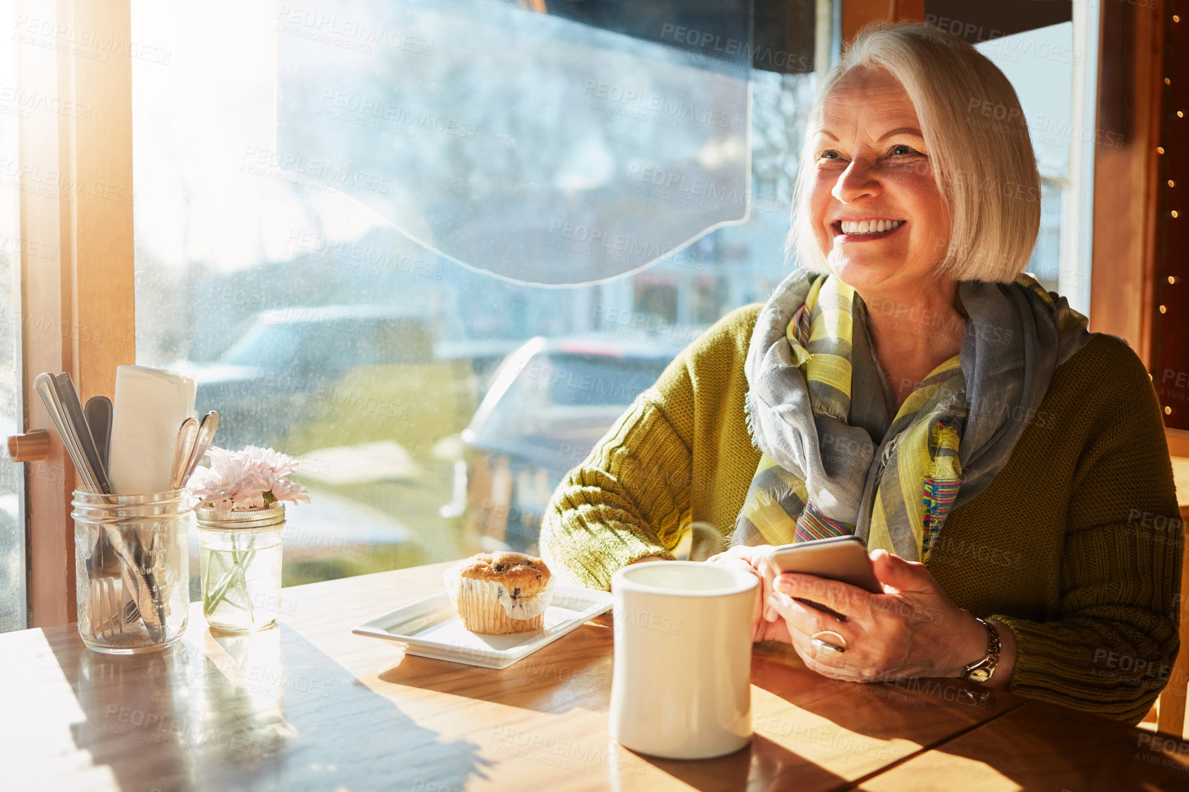 Buy stock photo Senior woman, smartphone and coffee in cafe for breakfast, app and digital menu with happy in city. Elderly person, muffin and smile in Sweden at restaurant with phone for email, chat or internet