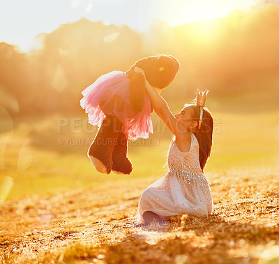 Buy stock photo Playing, nature or girl with teddy bear in park for love, orphan or fun toy for support, care or therapy. Relax, sun flare or kid on grass field with stuffed animal, princess costume or donation gift