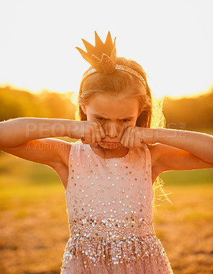 Buy stock photo Sad, child and crying outdoor at sunset for bullying, stress or anxiety for trauma or crisis in summer. Depression, girl and tears of kid at park with crown, princess costume or upset to stop playing