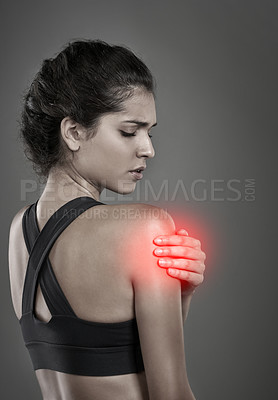 Buy stock photo Woman, shoulder pain and athlete for injury in studio, training accident and glow on gray background. Female person, sports and arthritis or risk of fibromyalgia, bruise and inflammation strain