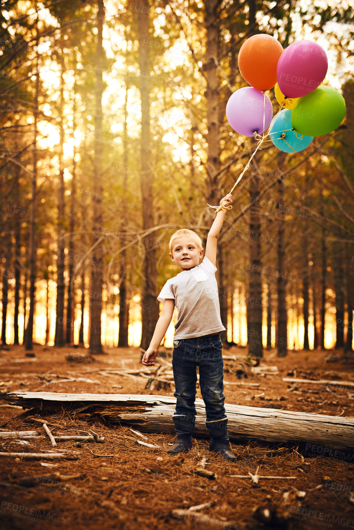 Buy stock photo Child, park or balloons for happiness in autumn holiday or vacation with smile, fun or outdoor travel. Young, boy or confident male kid alone to relax for adventure and playing in nature or forest