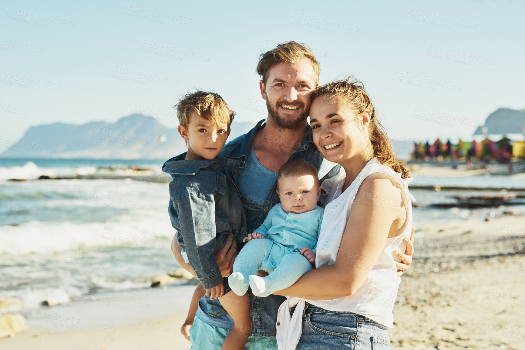 Buy stock photo Mother, father or children at beach for portrait, holiday or family travel with boys, toddler or baby. Parents, proud dad or mom with kids at sea on outdoor vacation with fun memory, smile or nature