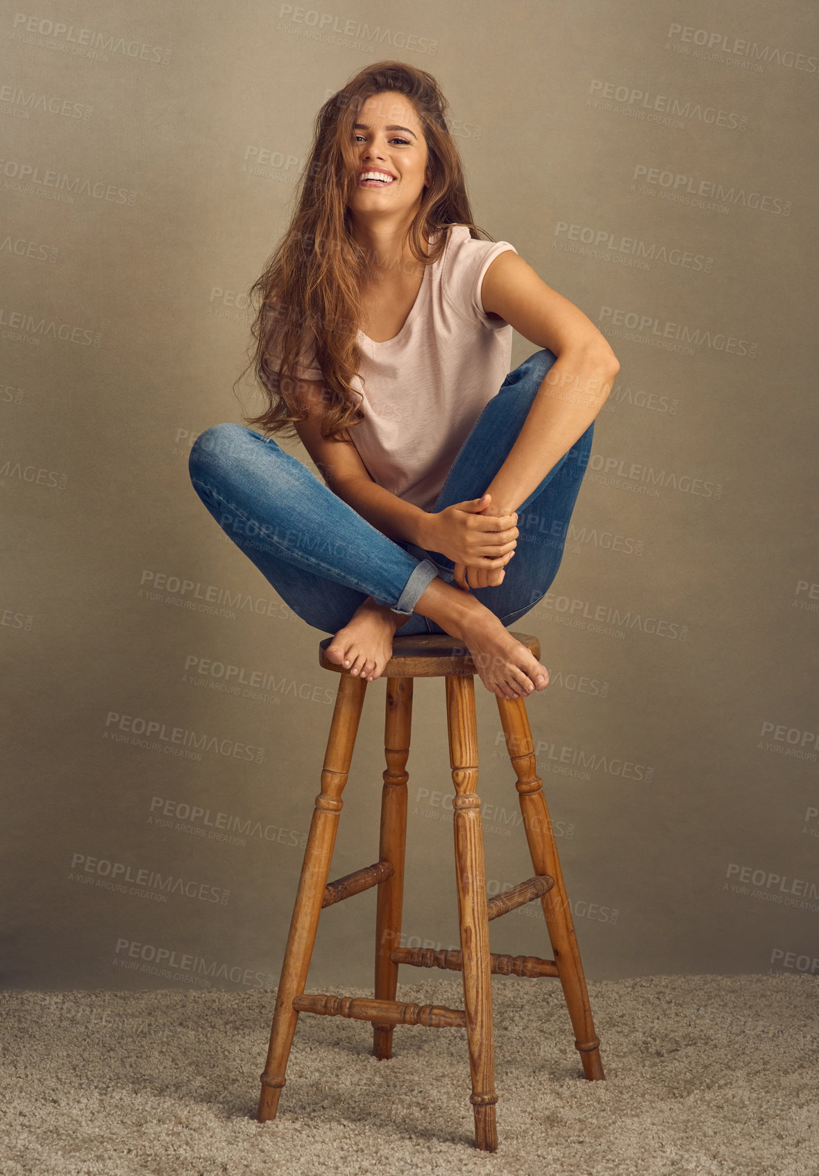 Buy stock photo Woman, fashion and chair with happy in studio on brown background with style and swag. Female person, smile and portrait for clothes or street wear, outfit and satisfied with trends in confidence