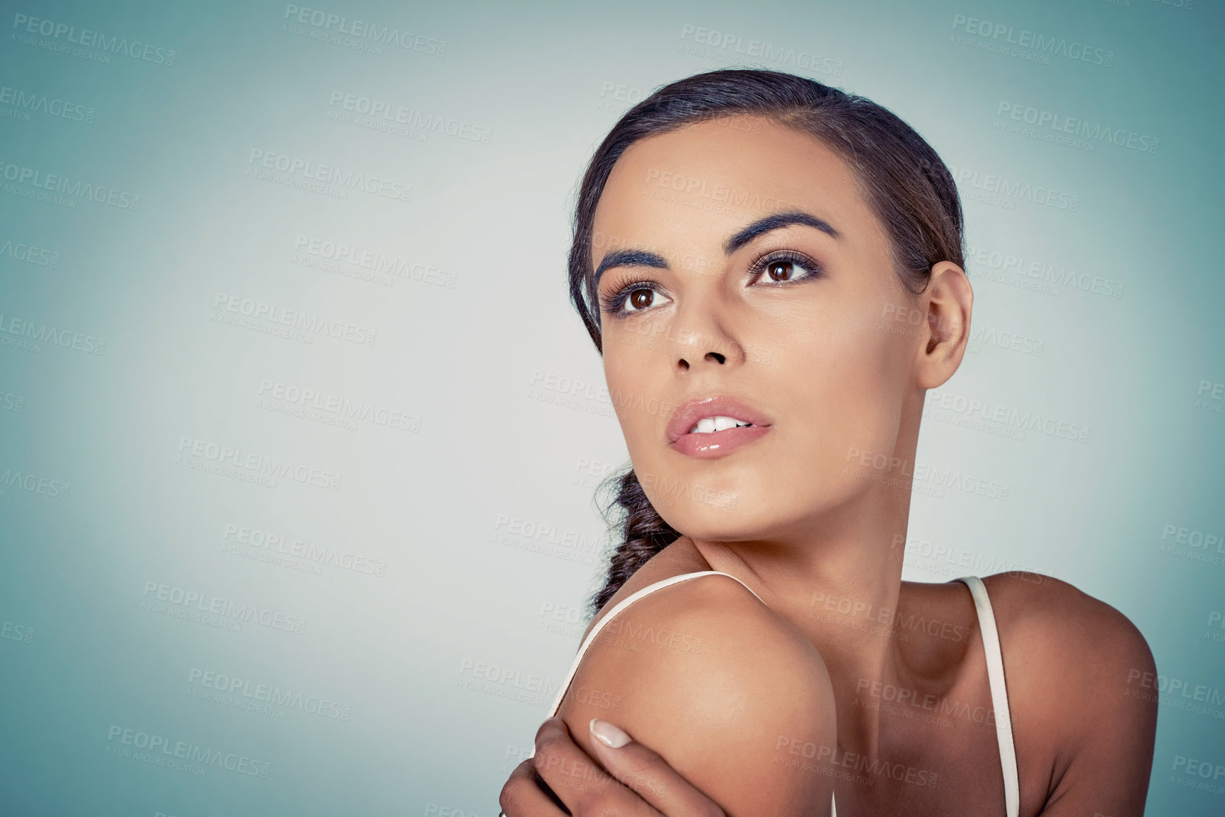 Buy stock photo Glow, mockup or woman thinking of beauty or skincare on blue background for shine, person or natural glow. Model, face or proud girl in studio for dermatology space, smooth results or facial health