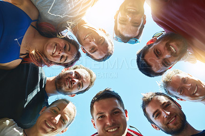 Buy stock photo Shot of a group of friends enjoying the day together outside