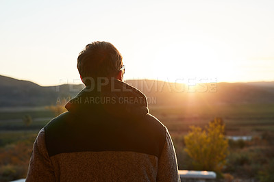 Buy stock photo Shot of an unrecognizable man spending the day outside