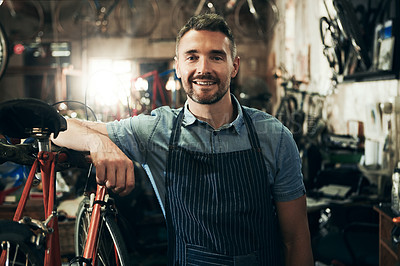 Buy stock photo Portrait, smile and repair man in bicycle shop working in store or cycling workshop. Face, bike mechanic and confident male person, business owner or mature professional technician from Australia.