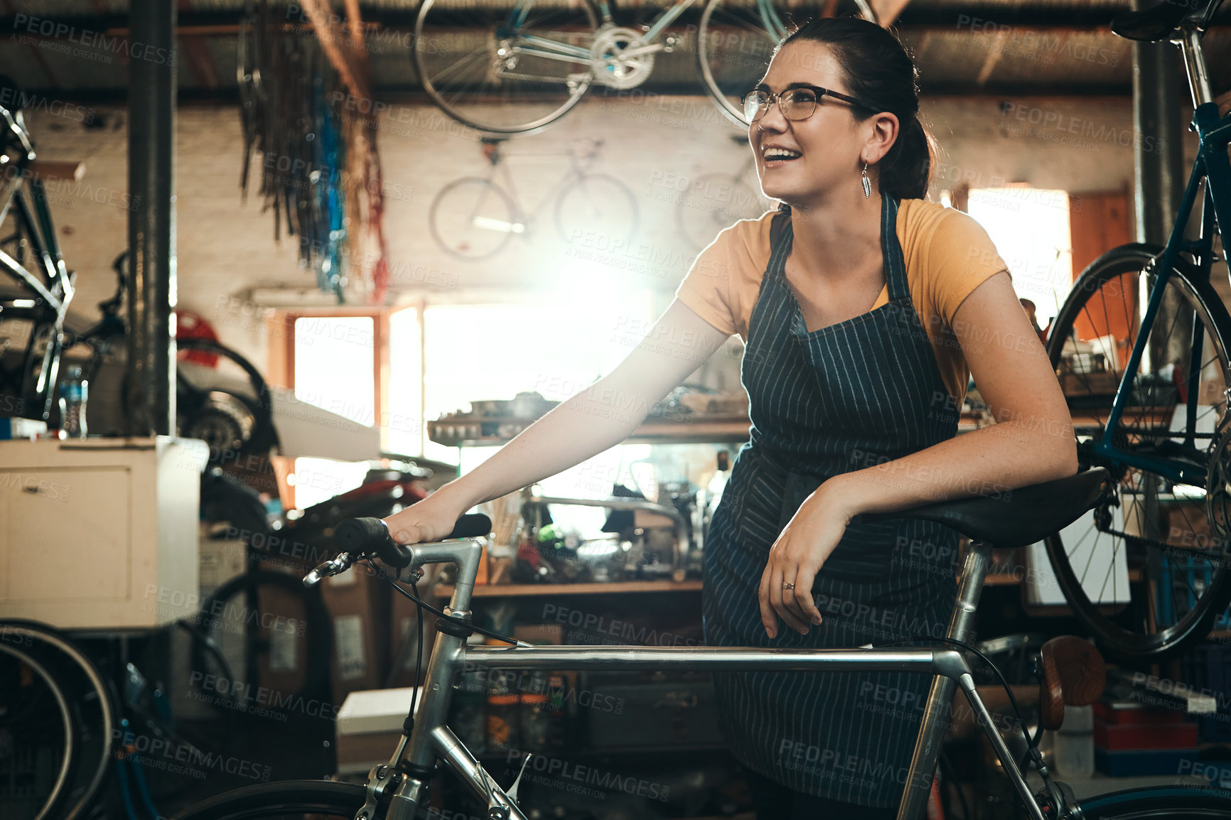 Buy stock photo Woman, bicycle shop and thinking for maintenance work, startup with transport service. Bike, mechanic and female entrepreneur in workshop with idea, thoughtful for sustainable business with happiness