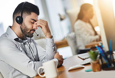 Buy stock photo Headache, tired or man in call center with burnout, head pain or overworked in crm communication. Migraine, office or stressed telemarketing sales agent frustrated with anxiety, fatigue or problem