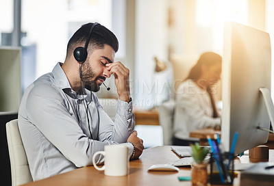 Buy stock photo Headache, stress or tired man in call center with burnout, head pain or overworked in crm communication. Migraine, office or telemarketing sales agent frustrated with anxiety, fatigue or problems