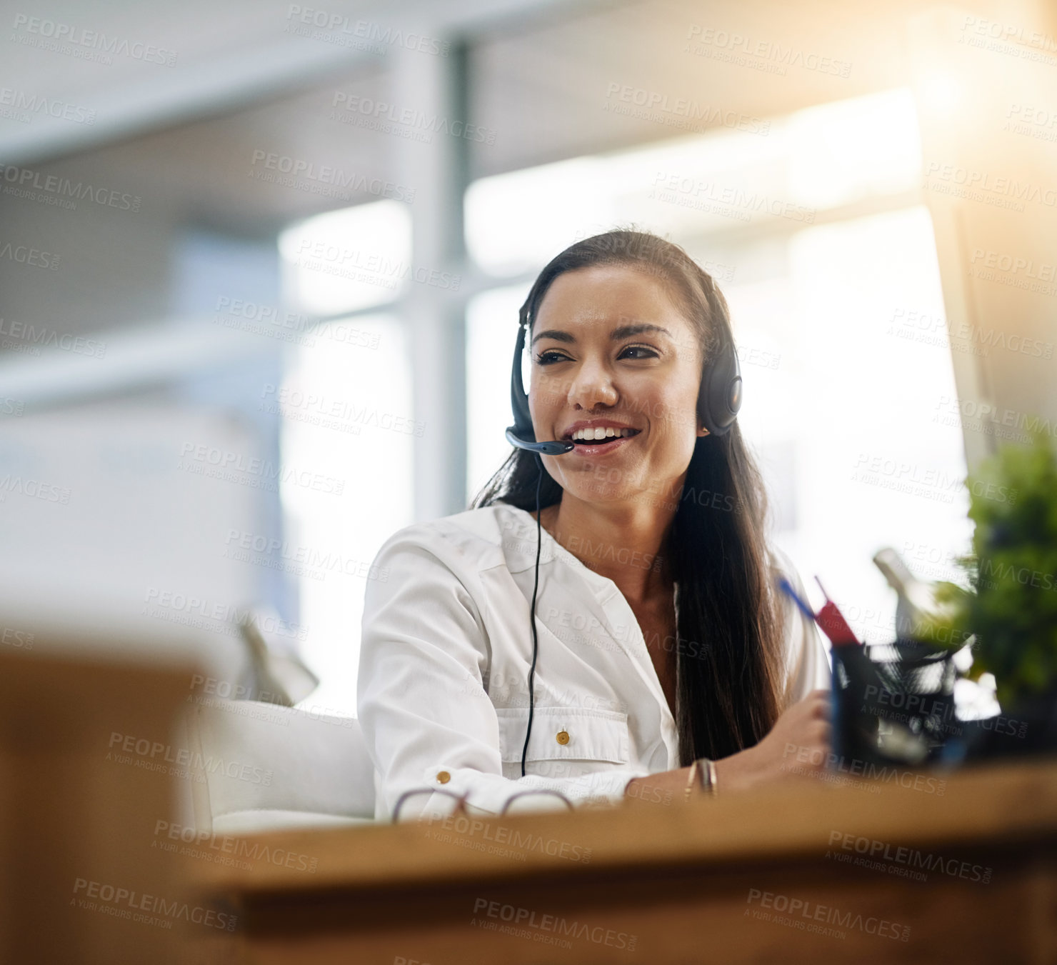 Buy stock photo Shot of a female agent working in a call centre