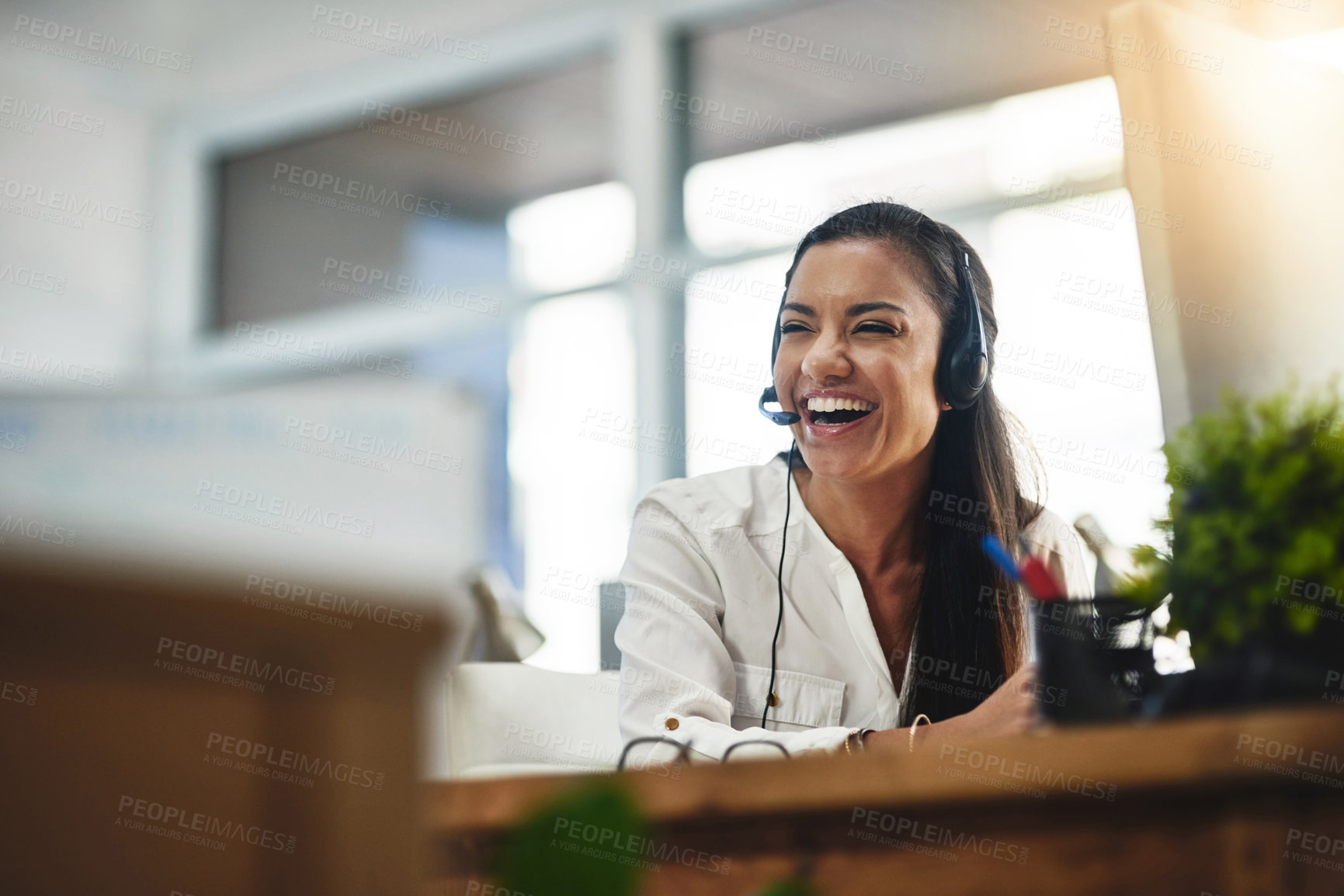Buy stock photo Funny, virtual assistant or happy woman in call center consulting, speaking or talking at help desk. Smile, friendly or sales consultant laughing in telemarketing customer services or telecom company