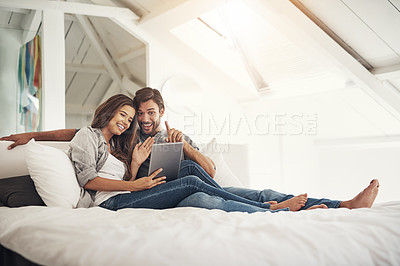 Buy stock photo Shot of an attractive young couple spending quality time at home