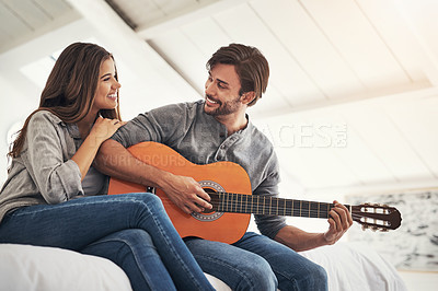 Buy stock photo Shot of an attractive young couple spending quality time at home