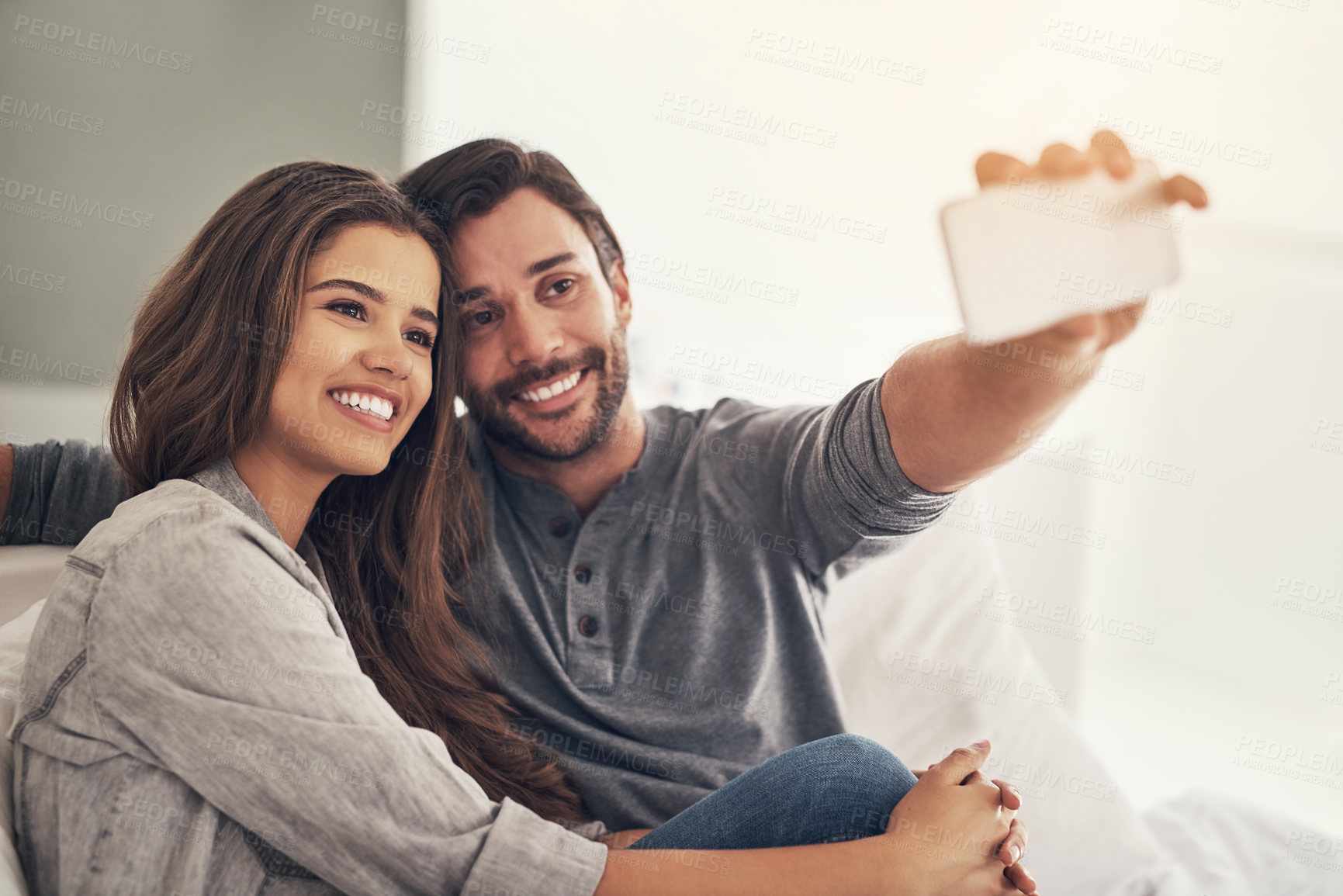 Buy stock photo Shot of an attractive young couple spending quality time at home