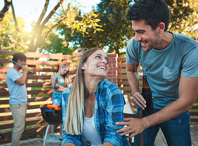 Buy stock photo Beer, laughing and smile with couple at party together for barbecue, celebration or fun in summer. Alcohol, bottle or love with happy man and woman in backyard of home for bonding or social gathering