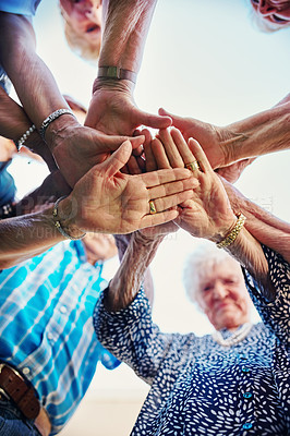 Buy stock photo Low angle shot of seniors hands huddled together outside
