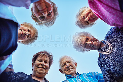 Buy stock photo Low angle shot of a group of seniors outside