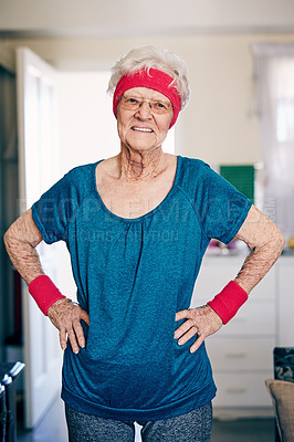 Buy stock photo Shot of a senior woman exercising at home