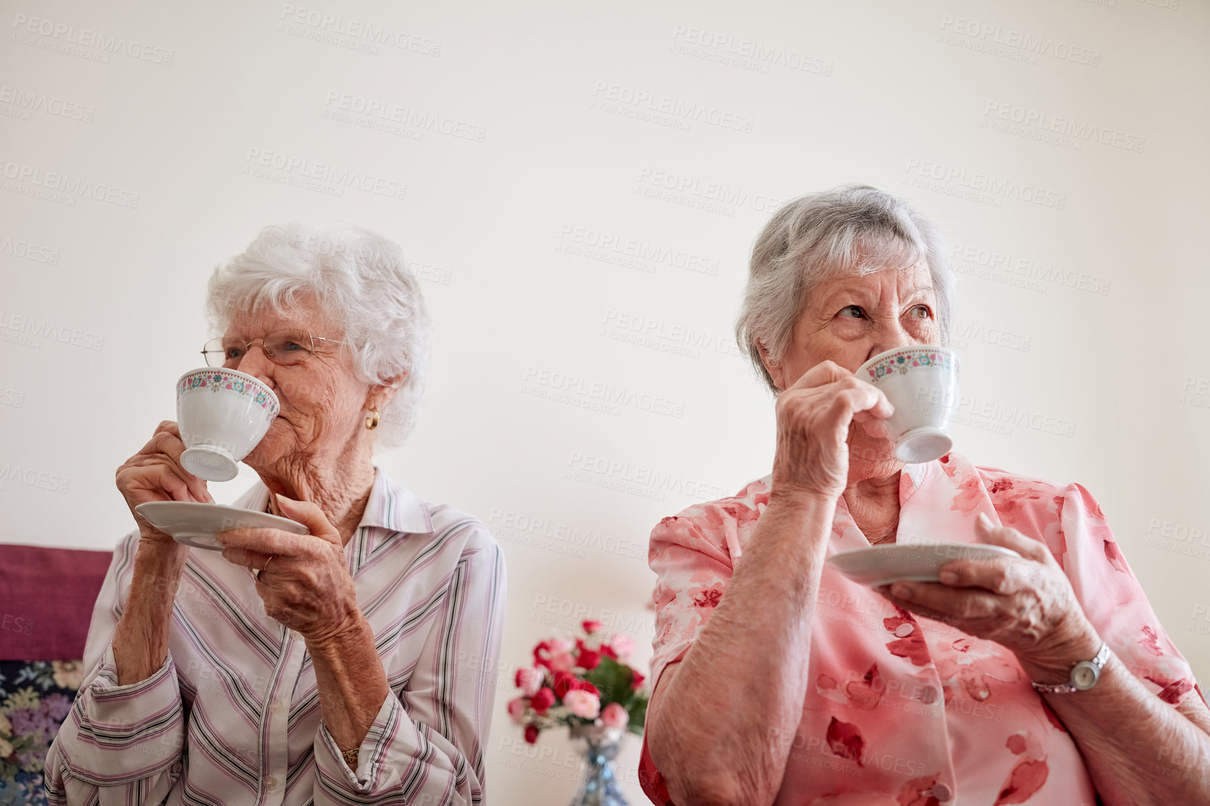 Buy stock photo Happy, relax and elderly women with tea, house and bonding together with break, care and friends. Old people, nursing home and senior ladies with cup for coffee, herbal beverage and smile in lounge