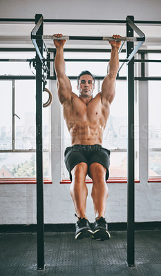 Buy stock photo Shot of a muscular man working out in a gym