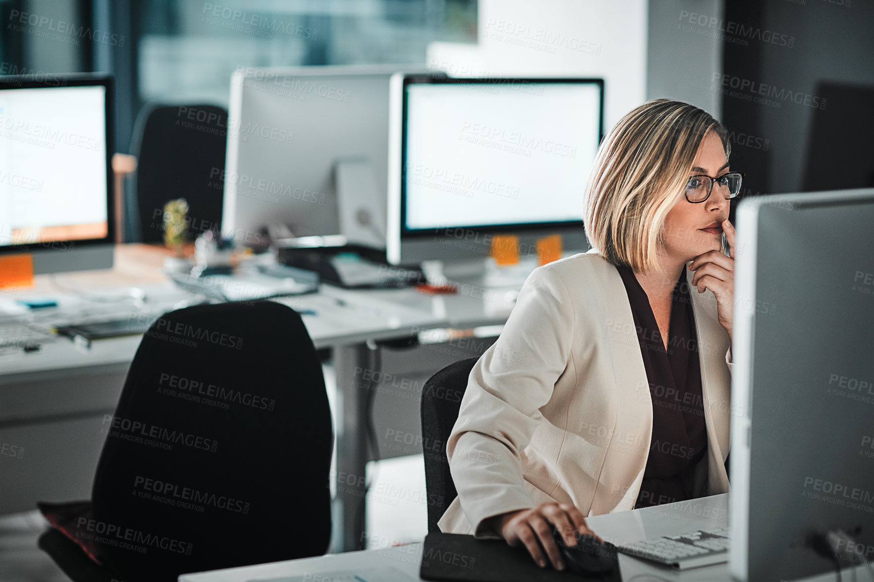 Buy stock photo Cropped shot of a businesswoman sitting at her desk