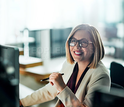 Buy stock photo Cropped shot of a businesswoman sitting at her desk