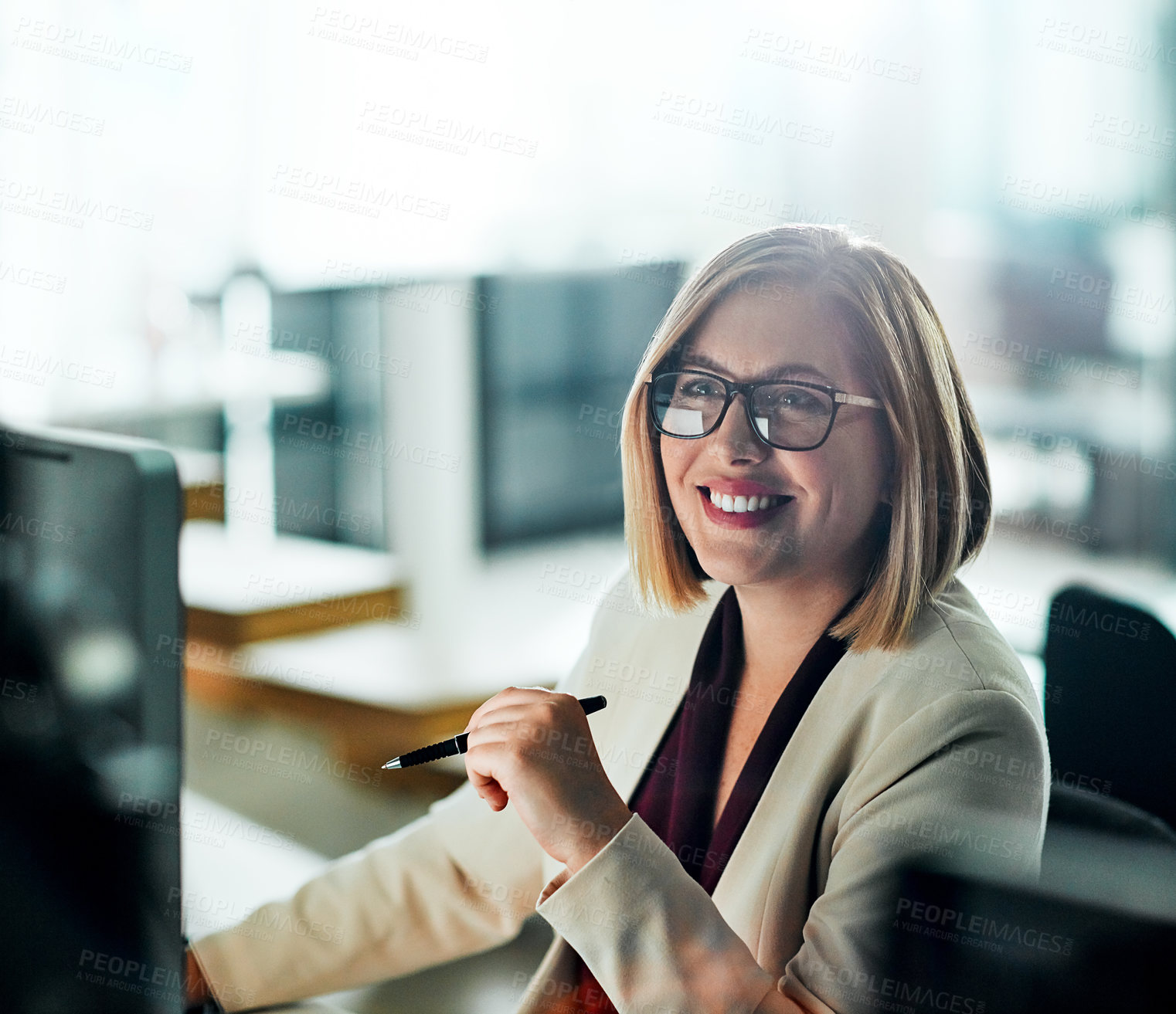 Buy stock photo Thinking, smile and businesswoman with glasses for work, computer and positive response in office. Happy person, corporate industry and success at desk for review, communication and research online