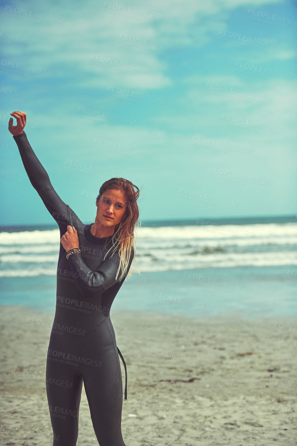 Buy stock photo Shot of a beautiful young woman going for a surf at the beach