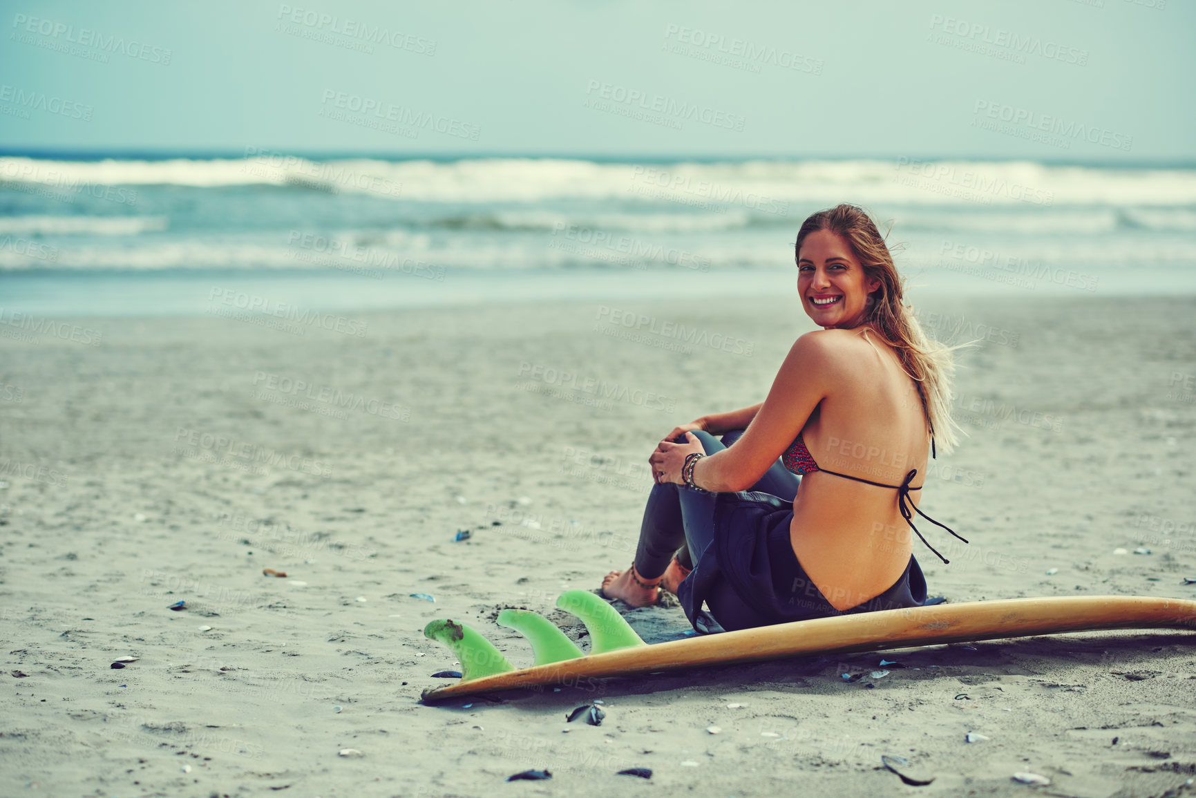 Buy stock photo Portrait of a beautiful young woman going for a surf at the beach