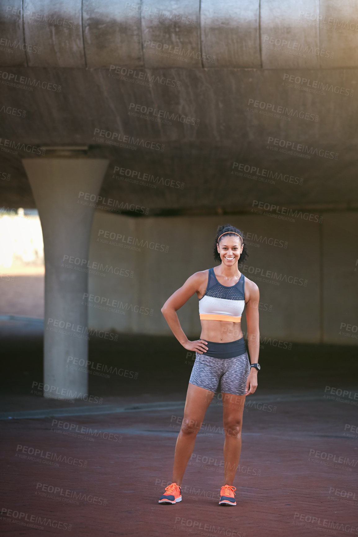 Buy stock photo Full length portrait of an attractive young woman taking a run through the city