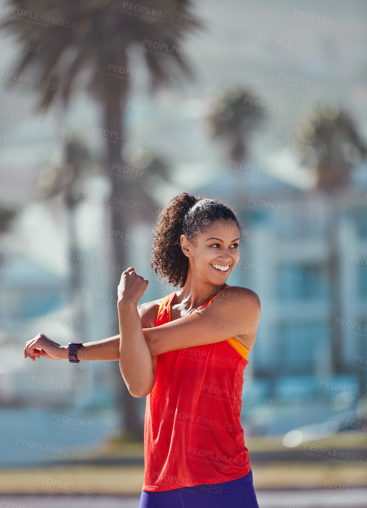 Buy stock photo Shot of a sporty young woman practising her exercise routine