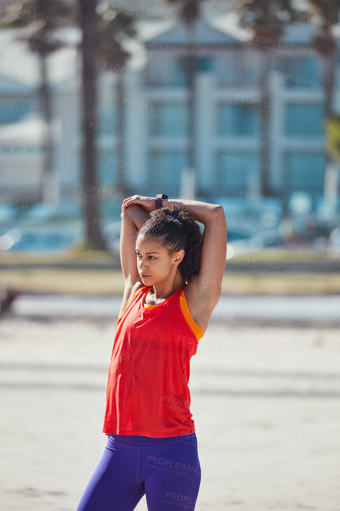 Buy stock photo Shot of a sporty young woman practising her exercise routine